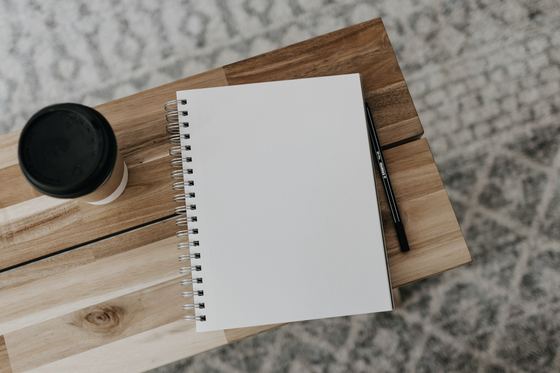 White printer paper on brown wooden table